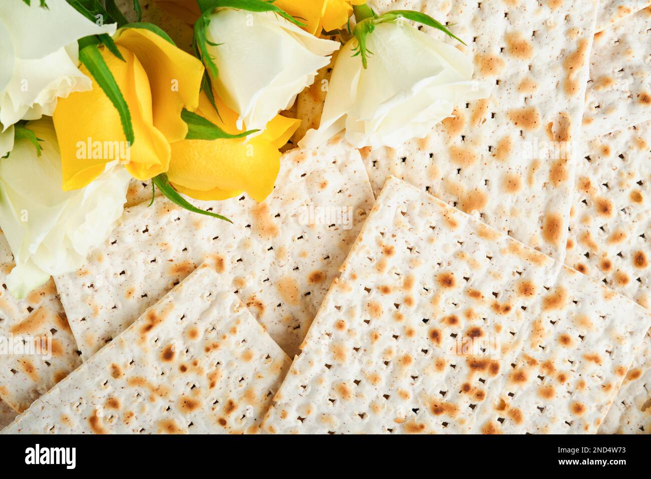 Passover celebration concept. Matzah, red kosher, white and yellow