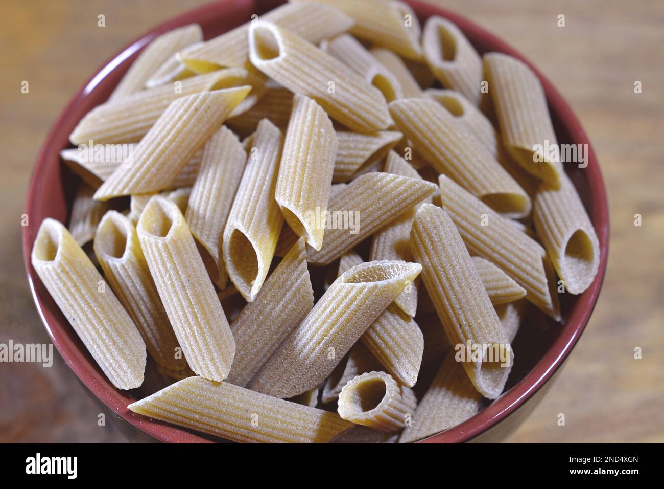 Italian food penne pasta in bowl, isolated, top view Italian culture