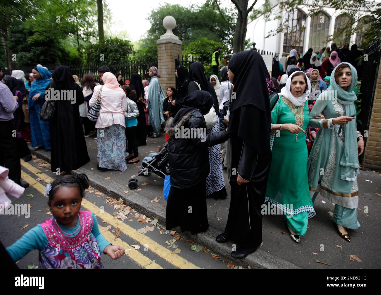 British Muslims exit London's Central Mosque across from Regent's Park ...