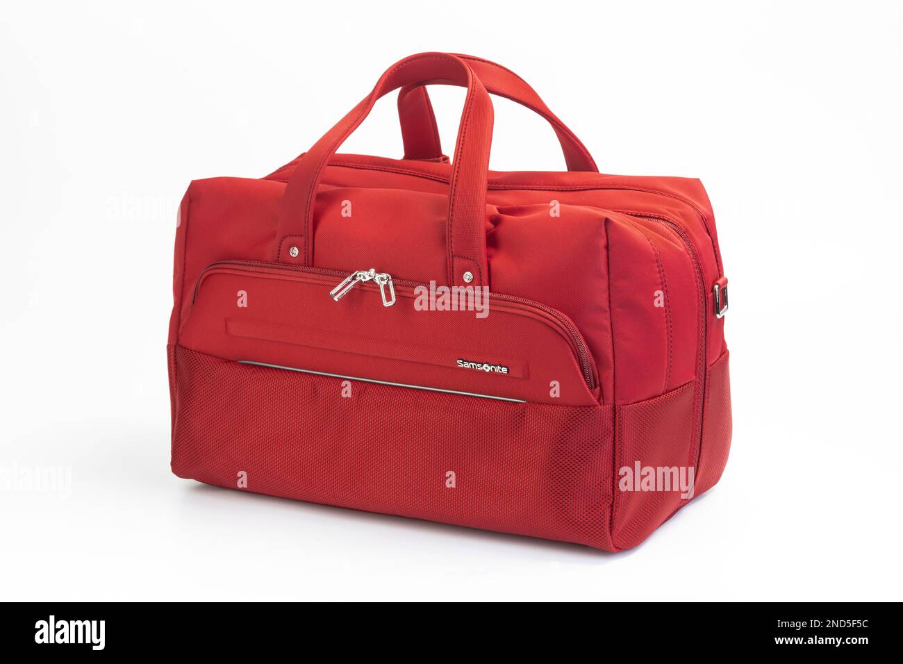 A red, lightweight Samsonite carry on flight bag. Stock Photo
