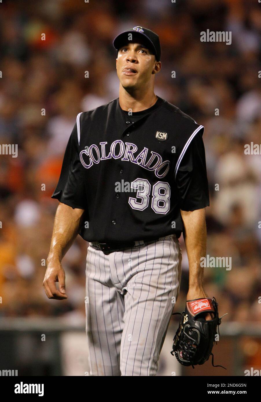 Colorado Rockies starting pitcher Ubaldo Jimenez walks back to the