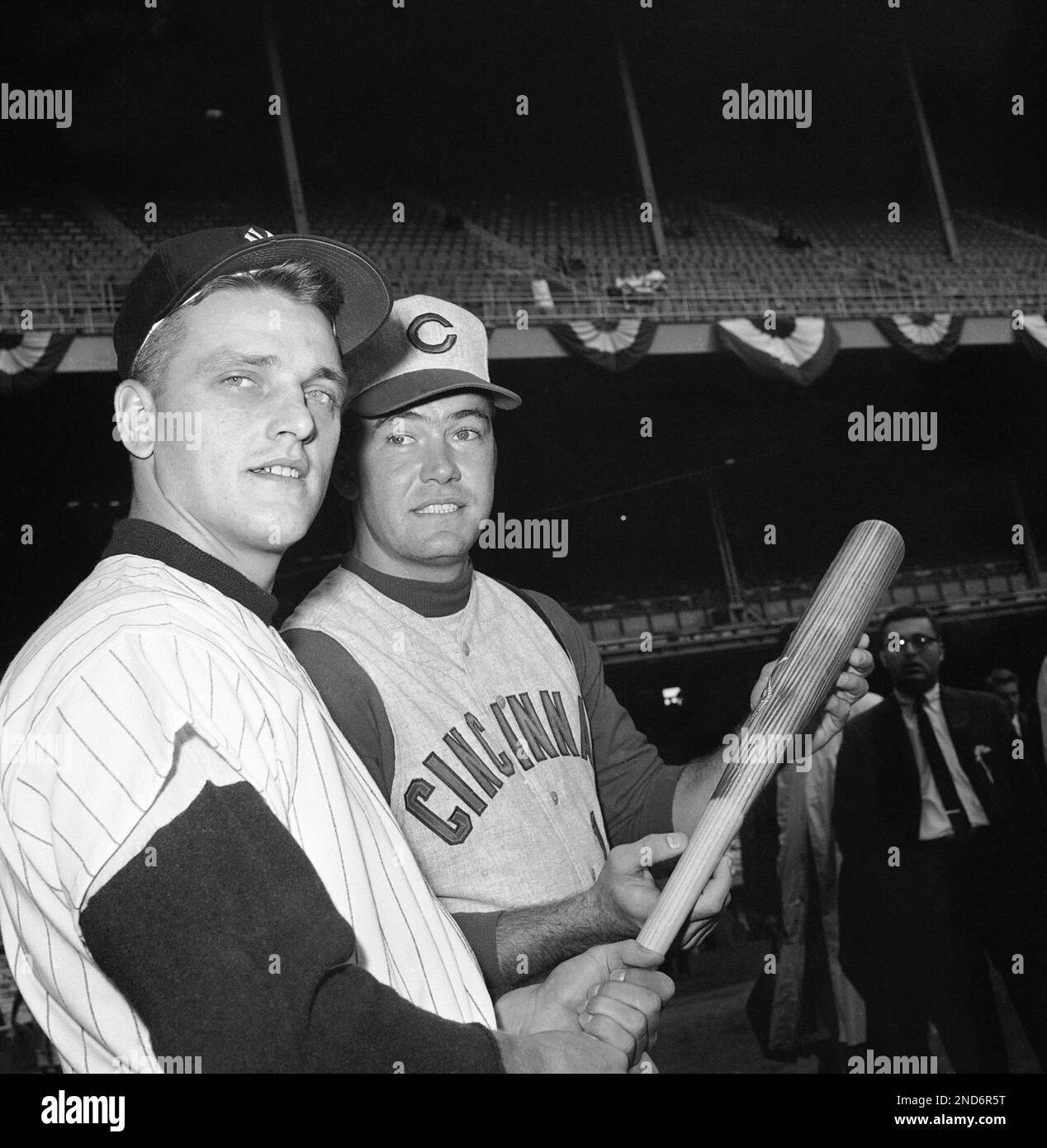 New York Yankee outfielder Roger Maris, left, chats with Cincinnati Red first baseman Gordy Coleman during pre-game workout for World Series opener at Yankee Stadium in New York Oct. 4, 1961. Maris, whose 61 home runs set major league record for full season’s play, will move to center field for series opener replacing ailing Mickey Mantle. (AP Photo) Stock Photo