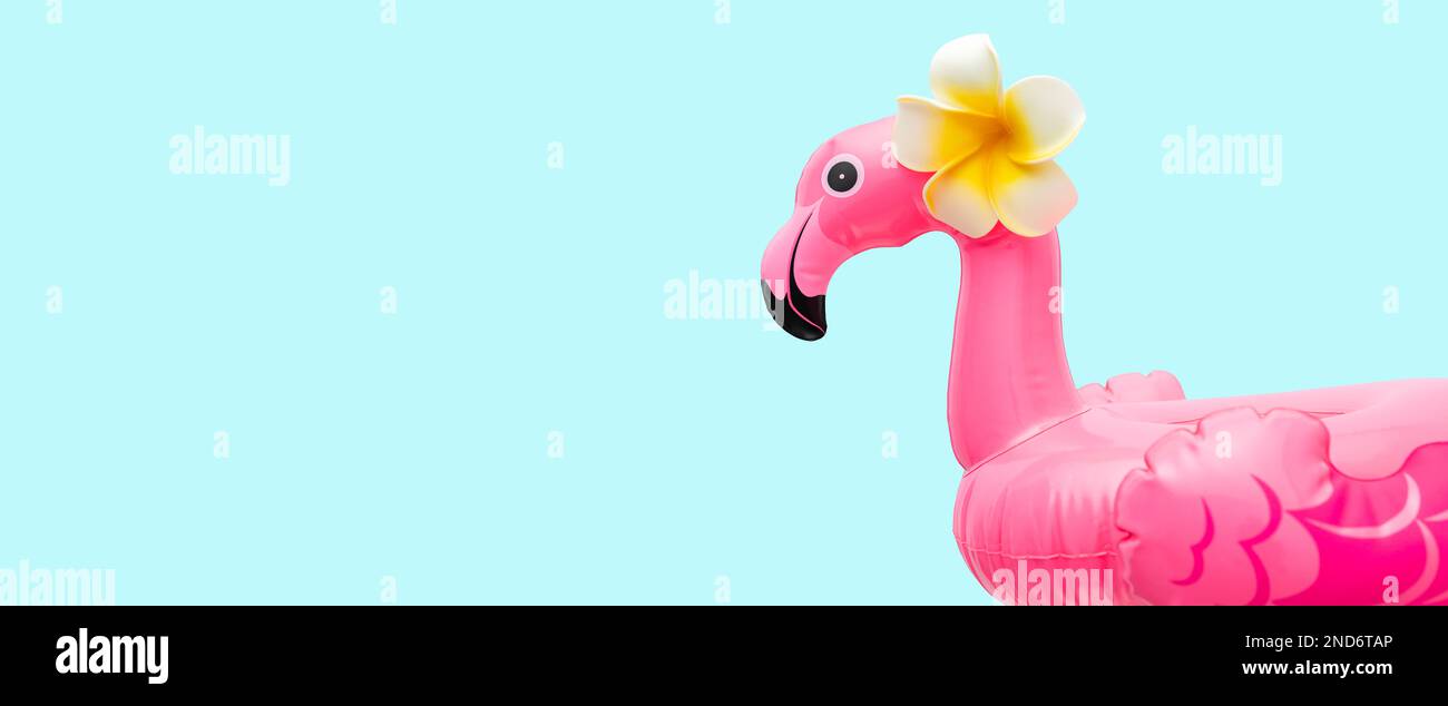 Pink flamingo on light background. Summer beach party concept. Flat lay, copy space. Stock Photo