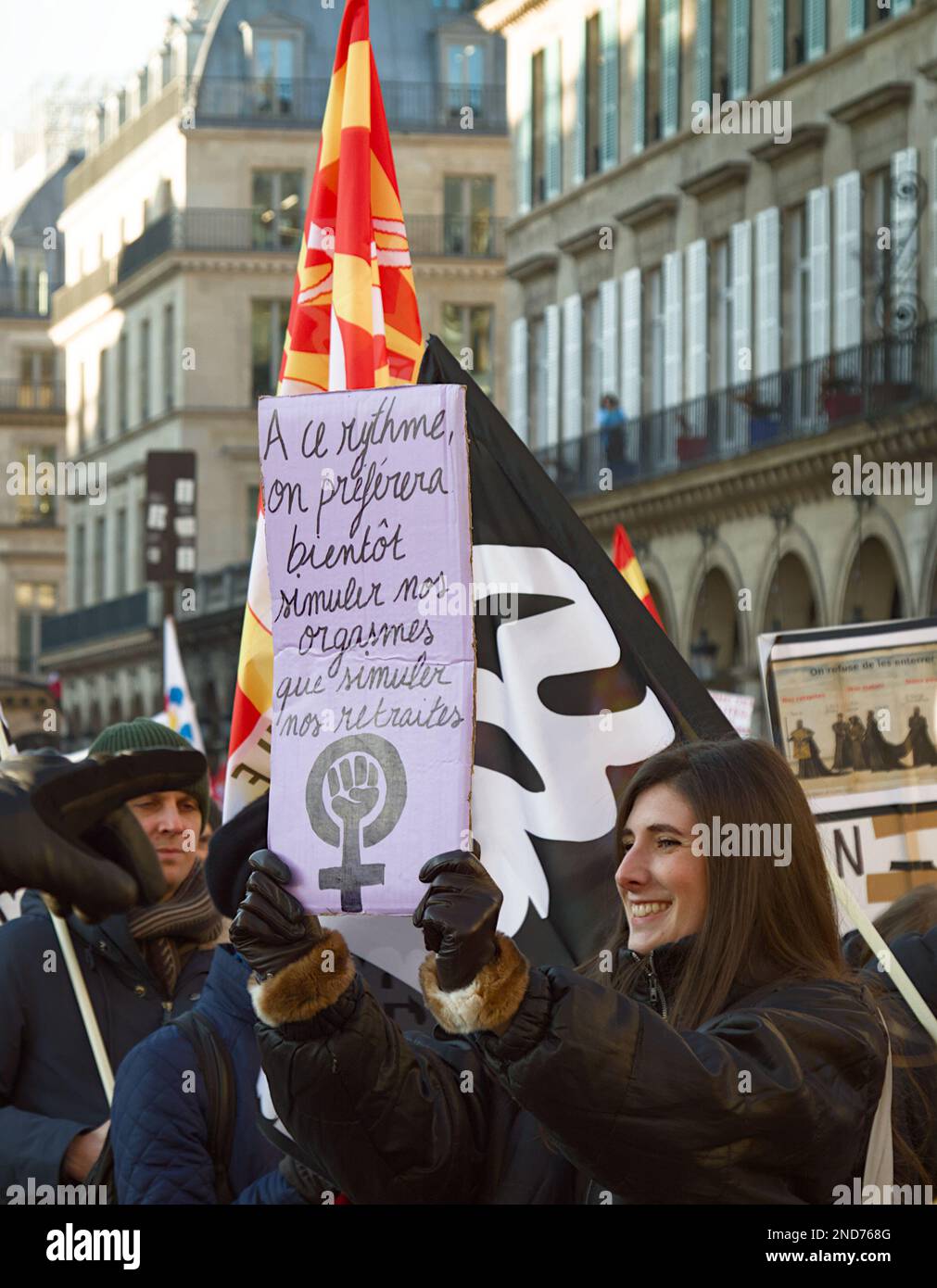 Young French Female Holding A Placard During The Protests Against The French Government Raising The Retirement Age, Paris France, 7th Feb 2023 Stock Photo