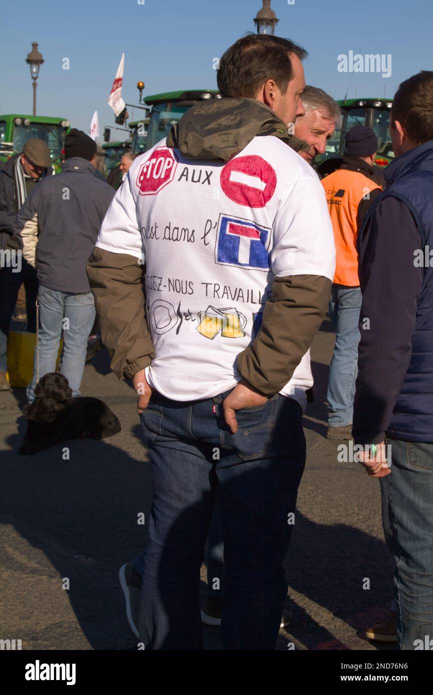 French Farmer Wearing A Hand Drawn Tee Shirt Protesting Against The French Government,Paris, 8th Feb 2023 Stock Photo