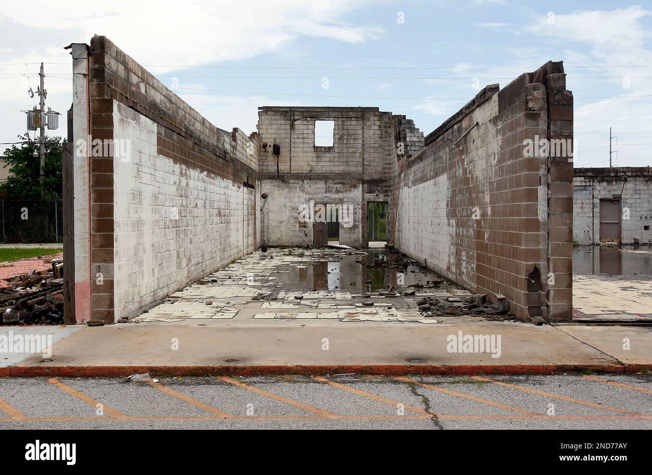 The remains of a store stand in a strip mall in Chalmette, La., Sunday