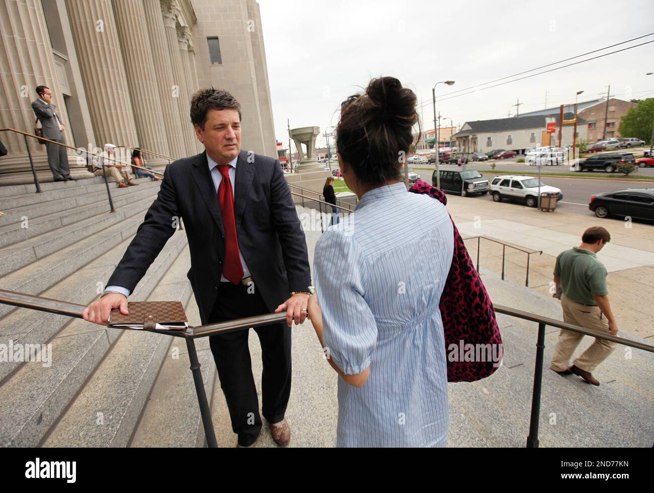 Attorney Rick Tessier talks on the steps of Orleans Parish Criminal