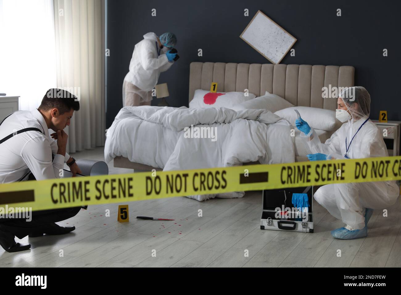 Investigators working at crime scene in messy room Stock Photo Alamy