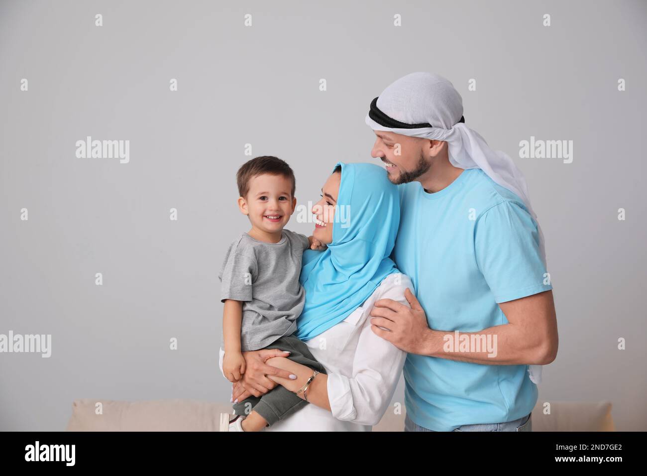 Happy Muslim family spending time together at home Stock Photo