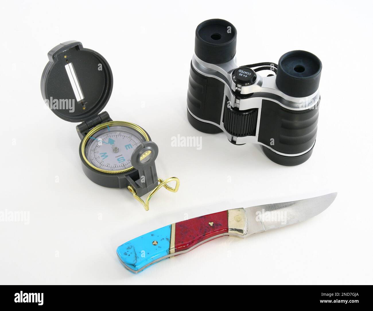 camping and hunting stuff binocular knife compass Stock Photo