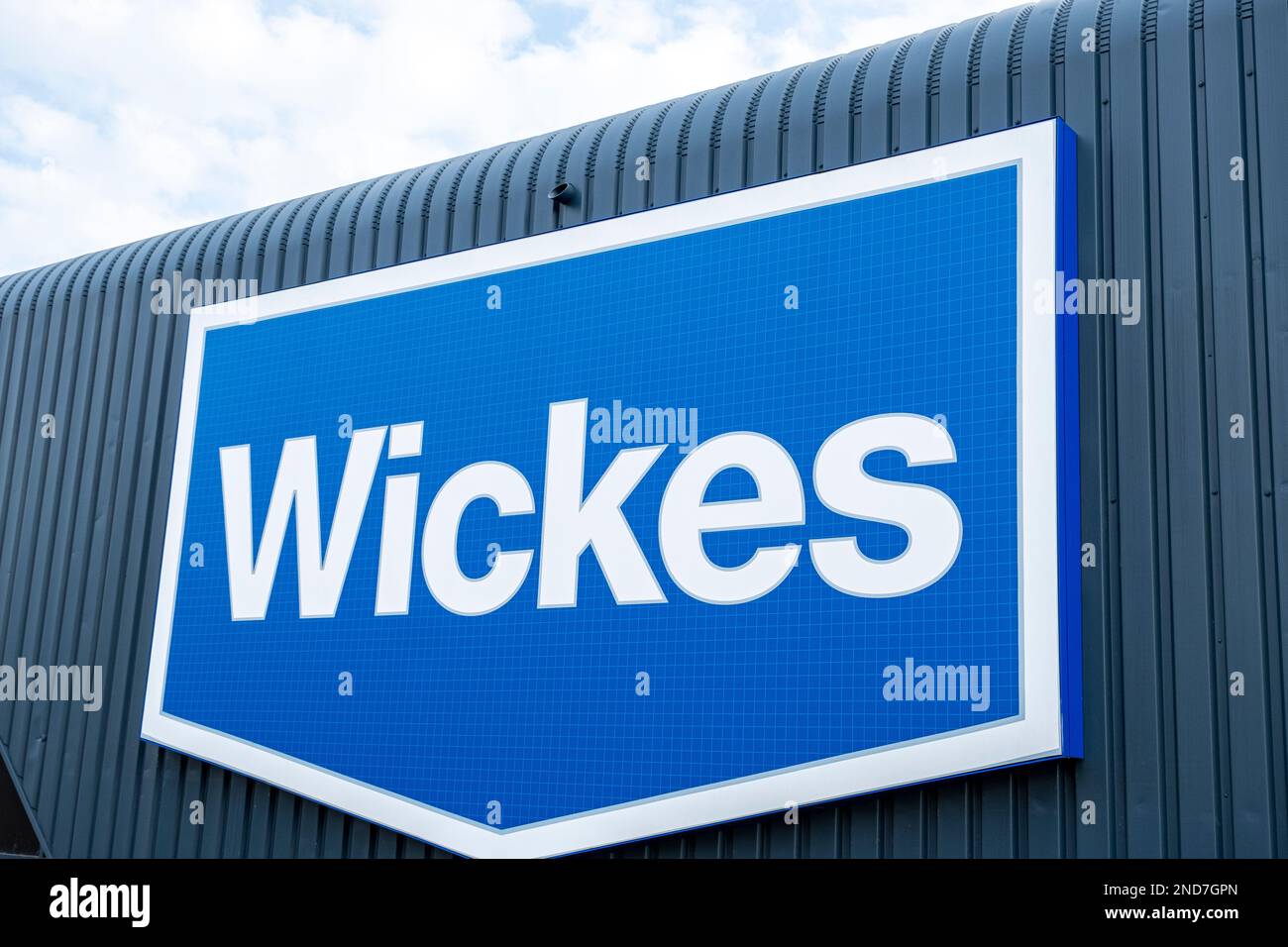 Close up of Wickes DIY store on outside wall UK Stock Photo