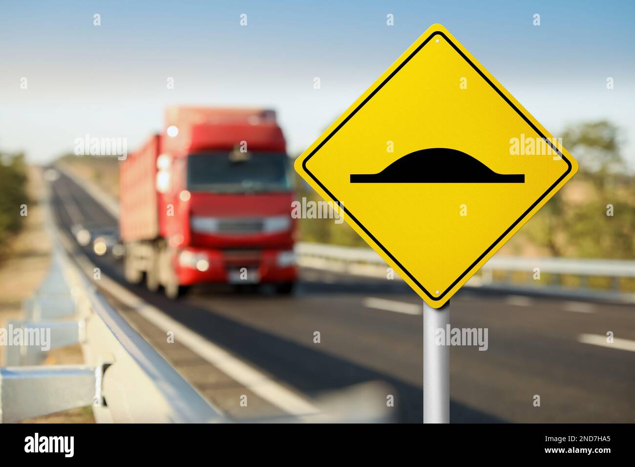 Sign Speed Bump near asphalt road outdoors Stock Photo Alamy