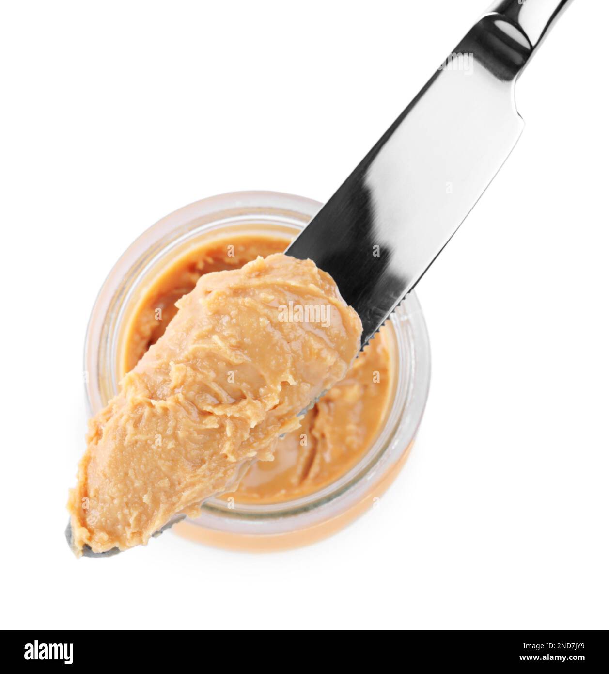 https://c8.alamy.com/comp/2ND7JY9/glass-jar-and-knife-with-tasty-peanut-butter-on-white-background-top-view-2ND7JY9.jpg