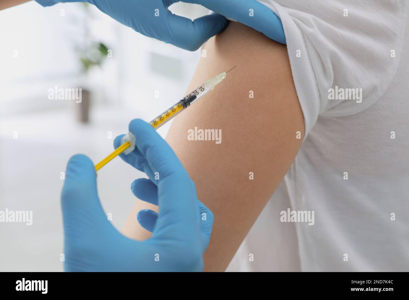 Immunization Injection Doctor giving injection to woman in hospital, closeup. Immunization ...