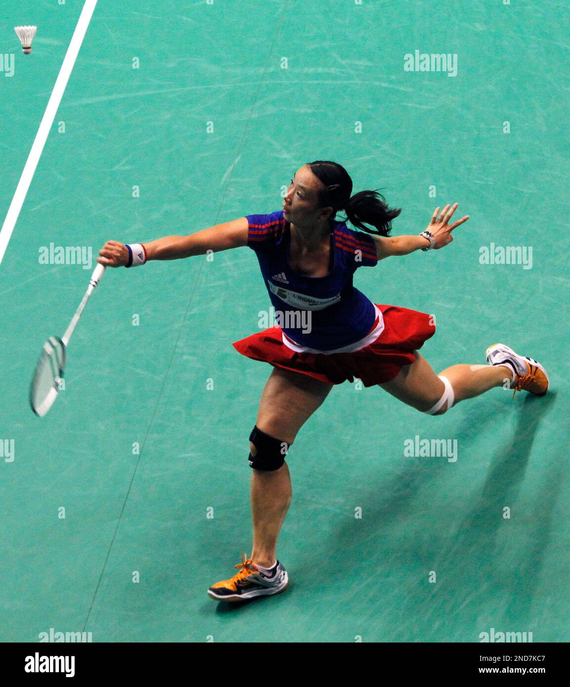 Hongyan Pi of France returns a shot against Xin Wang of China during their womens single quarterfinal match at the World Badminton Championships in Paris, Friday Aug