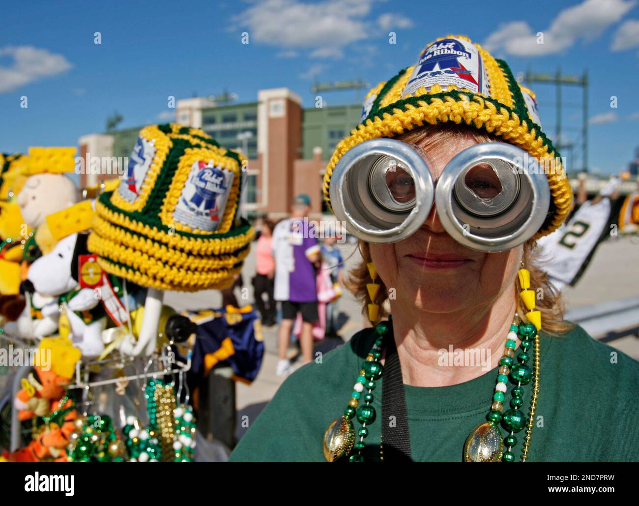 Sharon Meyer models some beer goggles that she is selling outside Lambeau  Field before an NFL preseason football game between the Green Bay Packers  and the Indianapolis Colts Thursday, Aug. 26, 2010,