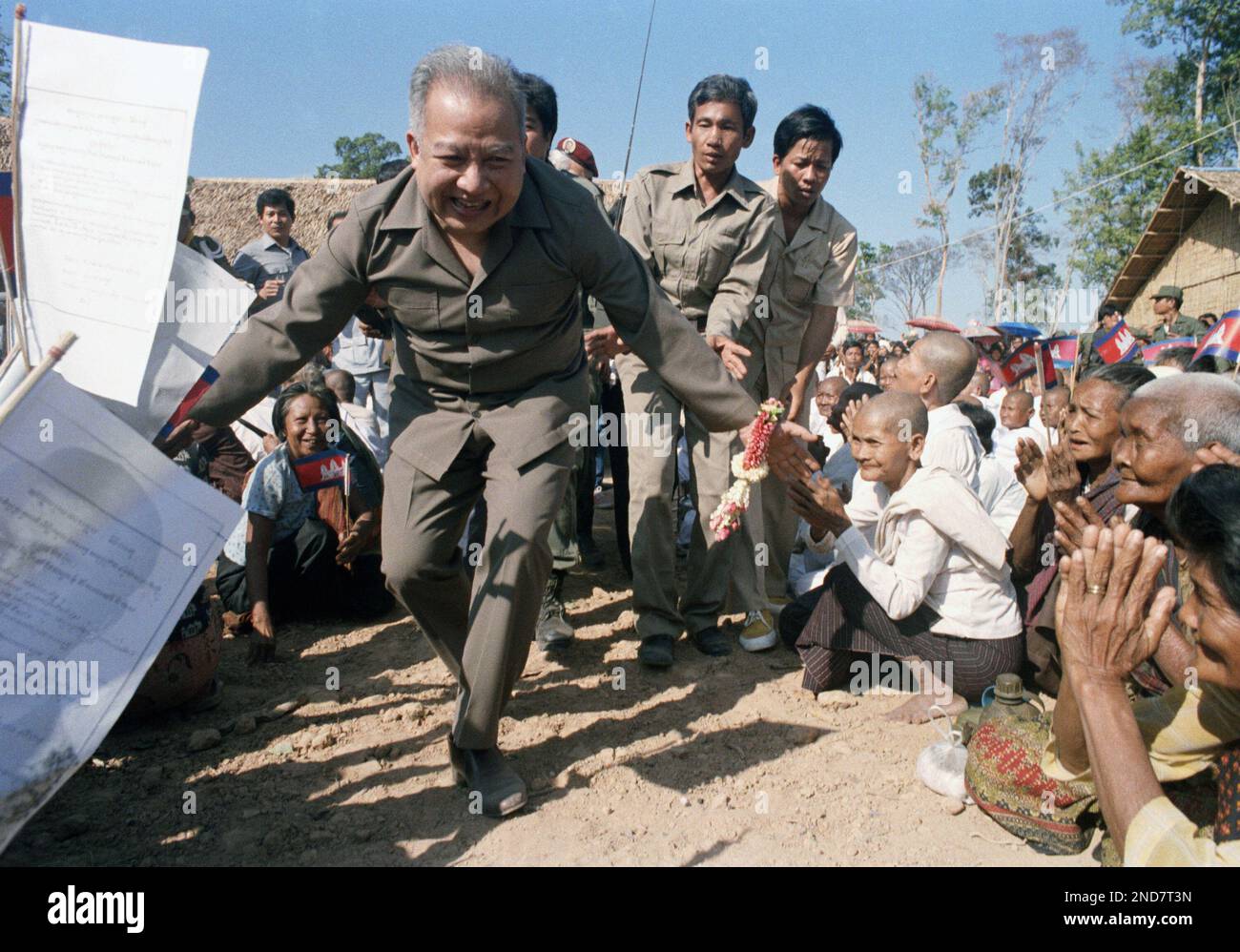 Cambodian Prince Norodom Sihanouk greets Khmer Rouge troopers at their ...