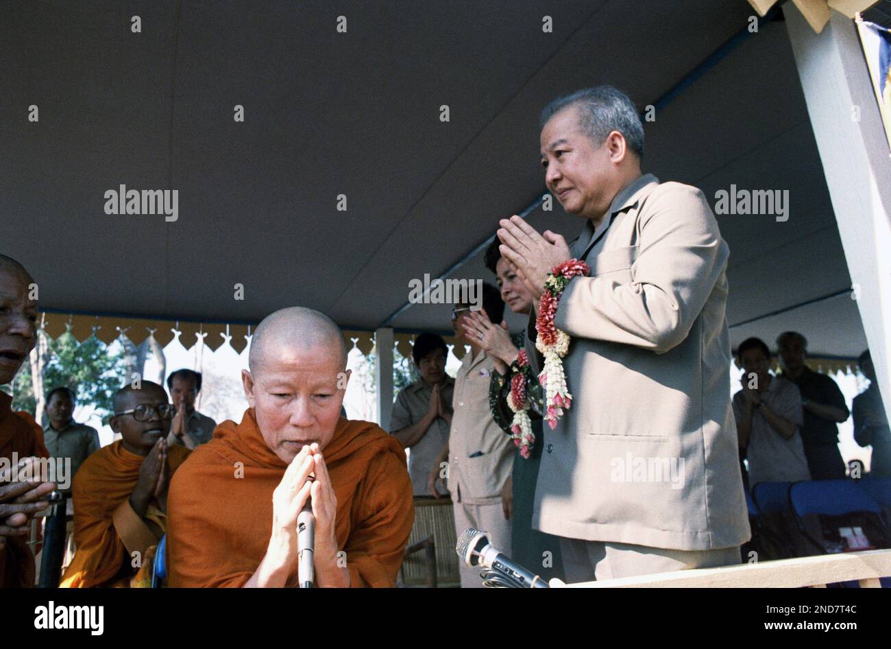 Cambodian Prince Norodom Sihanouk prays with Buddhist monks after ...