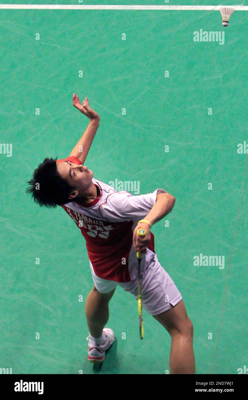 Kazushi Yamada of Japan plays a shot against Dicky Palyama of the Netherlands, during the World Badminton Championships in Paris, Thursday, Aug