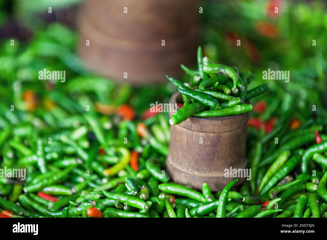 Full frame close-up on a stack of piment oiseau (Capsicum frutescens) on a market stall. Stock Photo