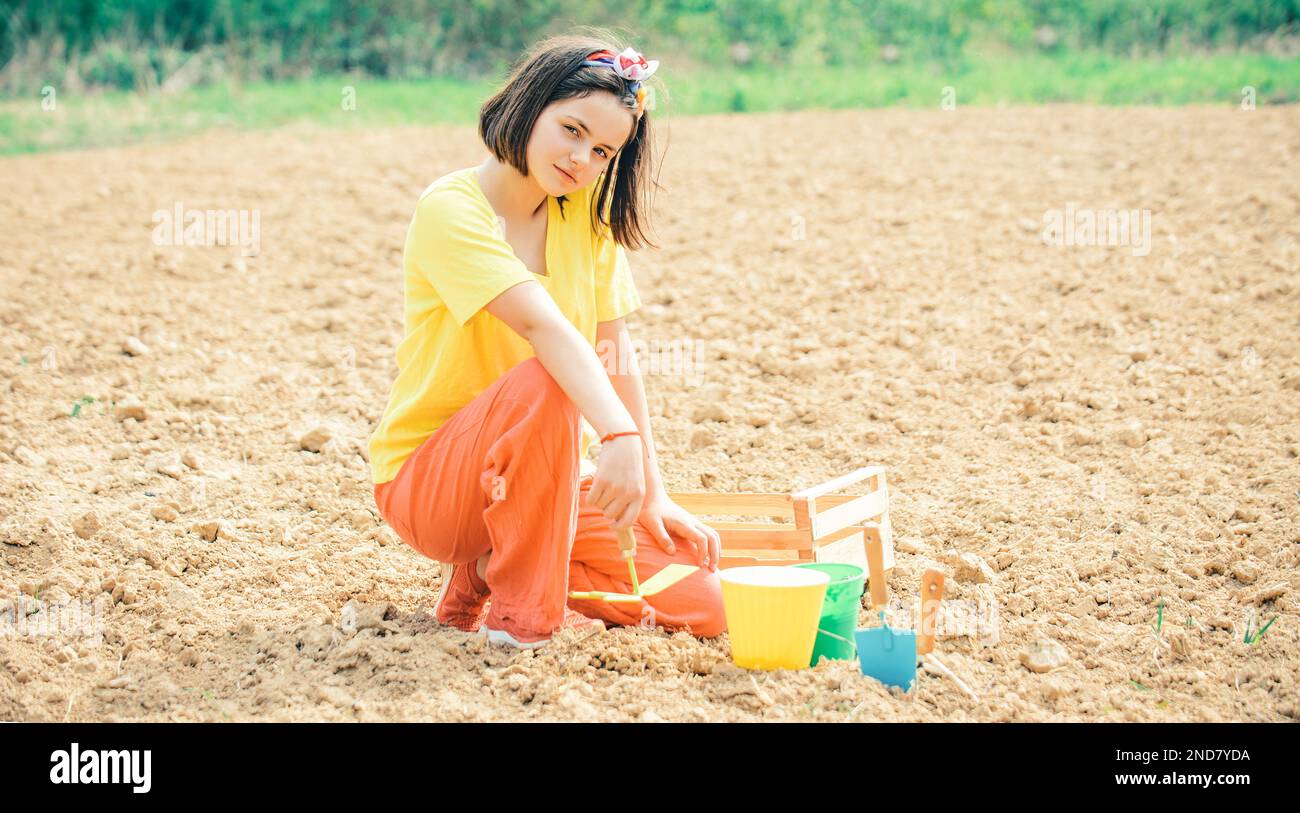 Childe Farming Routine Agriculture and arable farming for child farmer. Child farmer working ...
