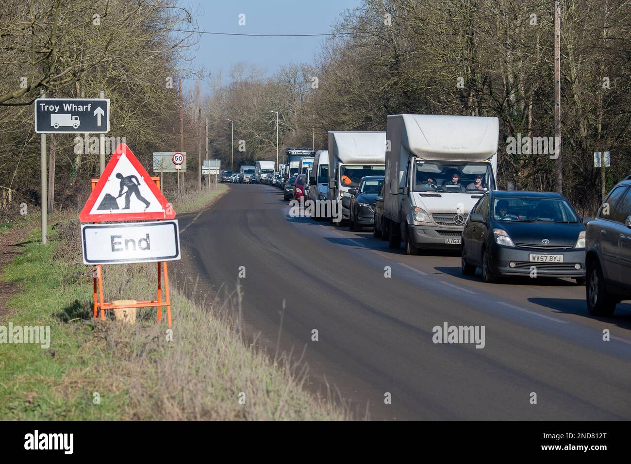 West Hyde, Hertfordshire, UK. 15th February, 2023. There were long queues today on the A412 London Oribtal Road in Denham and West Hyde due to HS2 traffic lights outside their Denham compound off the A412. A Police car with blue flashing lights was delayed and many motorists decided to turn around and go back towards Maple Cross as the queues were so long heading into Denham. HS2 contractor lorries that use the A412 were also stuck in the traffic jams. Credit: Maureen McLean/Alamy Live News Stock Photo