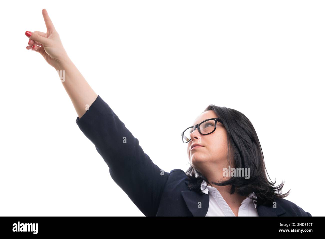 Adult businesswoman wearing spectacles and smart casual clothing pointing index finger at blank copyspace as corporate entrepreneurship concept isolat Stock Photo