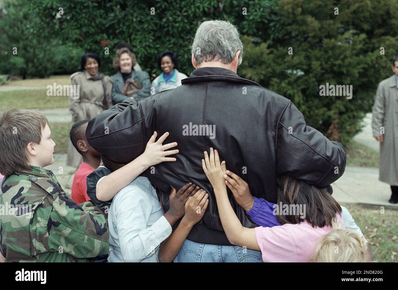Presidentelect Bill Clinton gets the full attention of children who