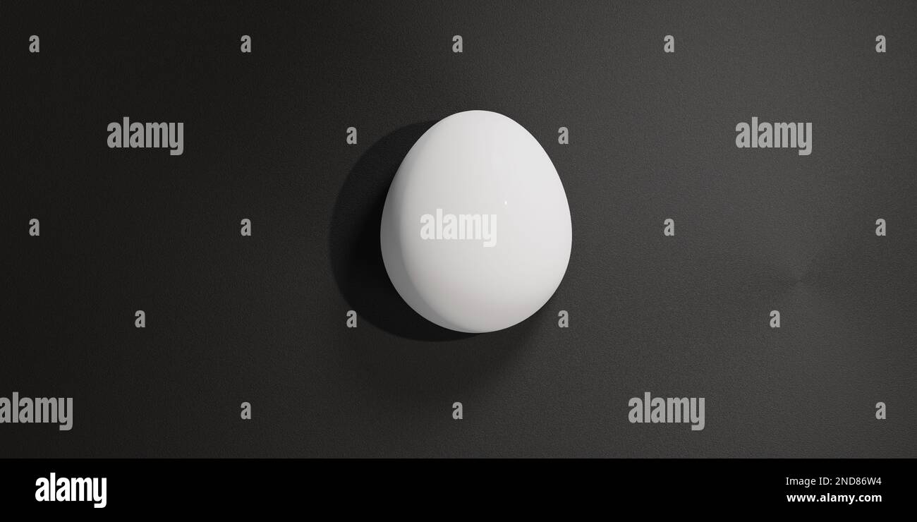 A white egg making shadow on the dark background Stock Photo - Alamy
