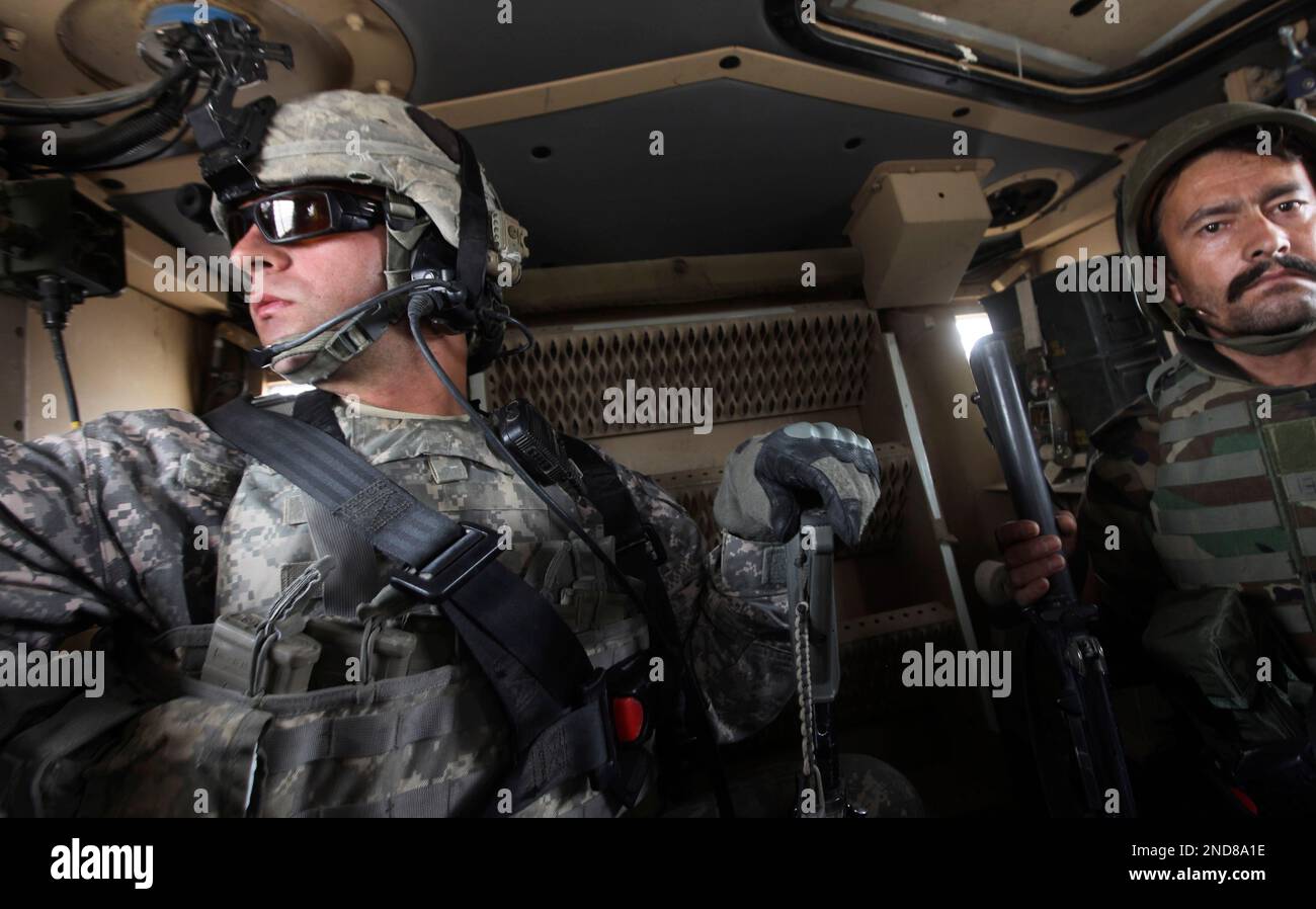 U.S. Army Cpl. Tom Hoyt, left, of the Bay Area, Calif., with the 2nd ...