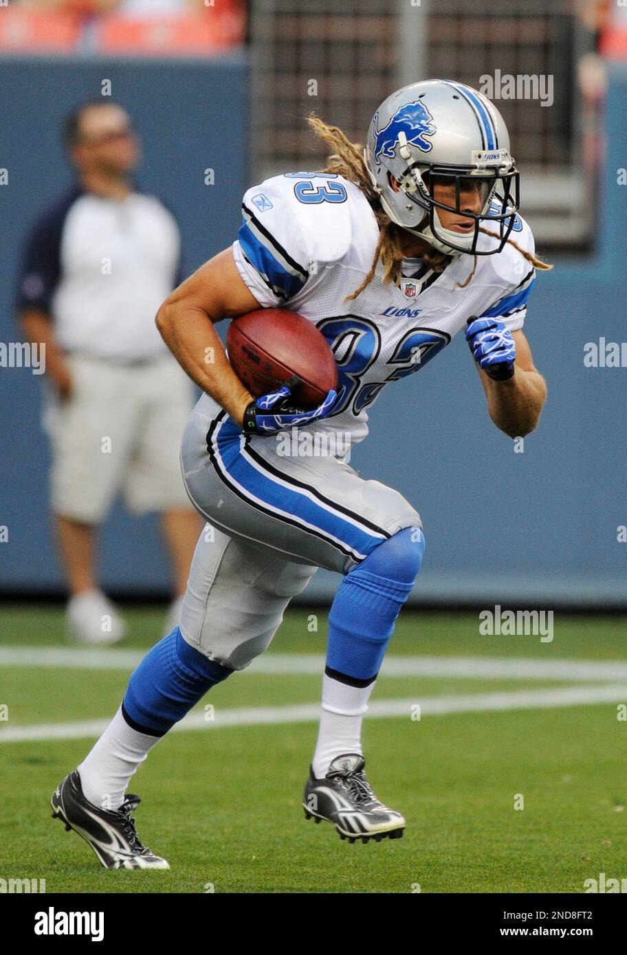 Detroit Lions wide receiver Tim Toone returns the ball on a kickoff