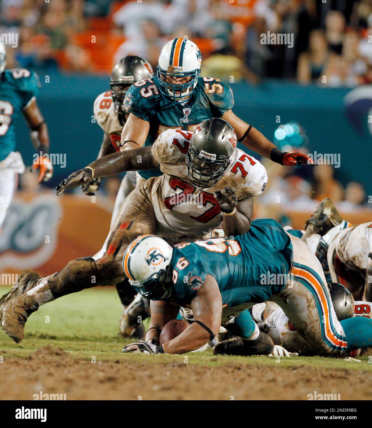 Tampa Bay Buccaneers' wide reciever Charles Lee (82) tries to elude a  tackle from Houston Texans' Marcus Coleman (42) during the Bucs' 16-3 win  against the Texans at Raymond James Stadium in