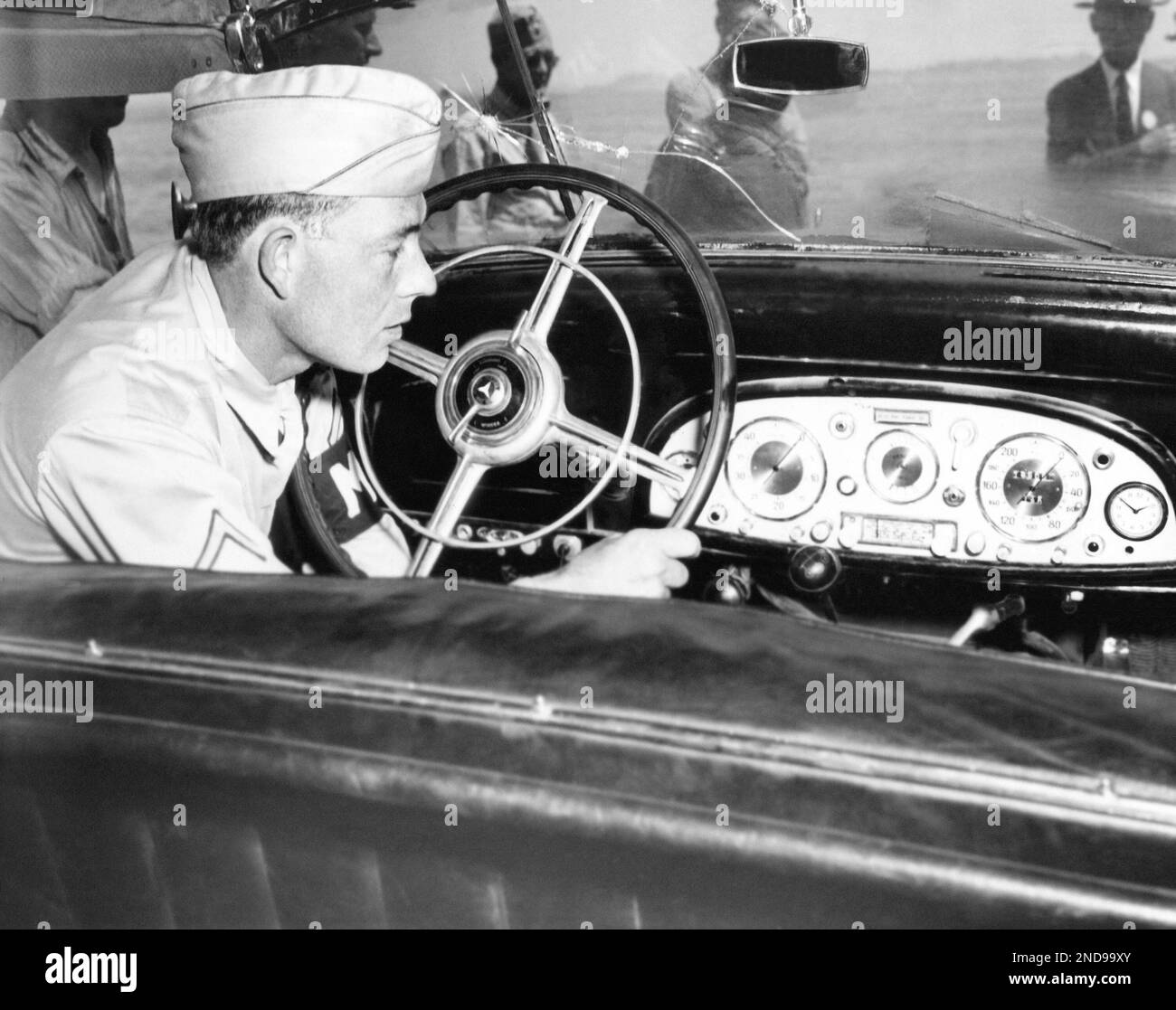 An unidentified MP inspects the dashboard of Reichsmarshall Hermann ...