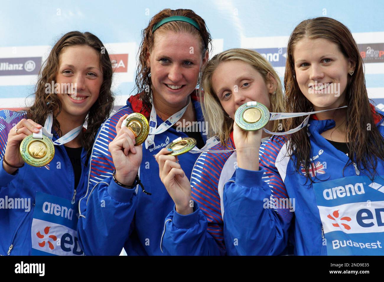 Britain's gold medal winning team show off their medals after the Women
