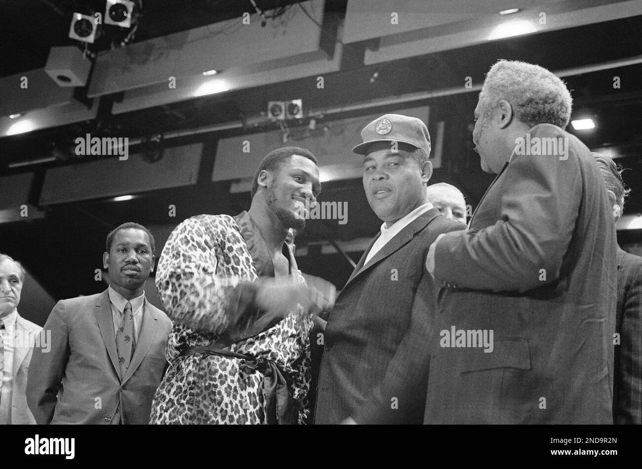 Heavyweight champion Joe Frazier, left, poses with former heavyweight