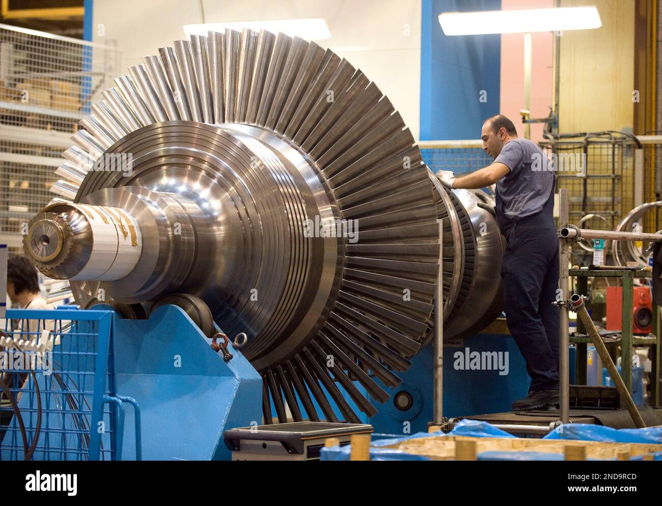 Picture taken Oct. 14, 2009 shows employees of MAN Turbo company