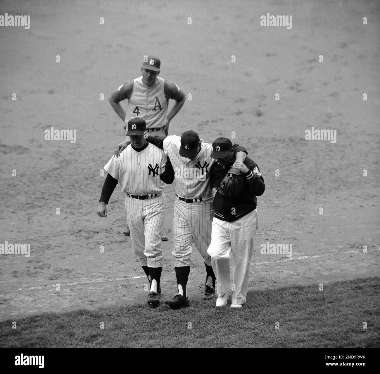 https://c8.alamy.com/comp/2ND9RWK/yankee-coach-vern-benson-left-and-trainer-joe-soares-right-help-outfielder-roger-maris-off-the-field-at-new-yorks-yankee-stadium-on-april-28-1965-the-slugger-injured-his-right-leg-while-making-tough-catch-against-kansas-city-athletics-during-which-he-fell-heavily-maris-may-be-sidelined-as-long-as-three-weeks-the-injury-was-to-the-hamstring-muscle-of-the-right-thigh-ap-photo-2ND9RWK.jpg