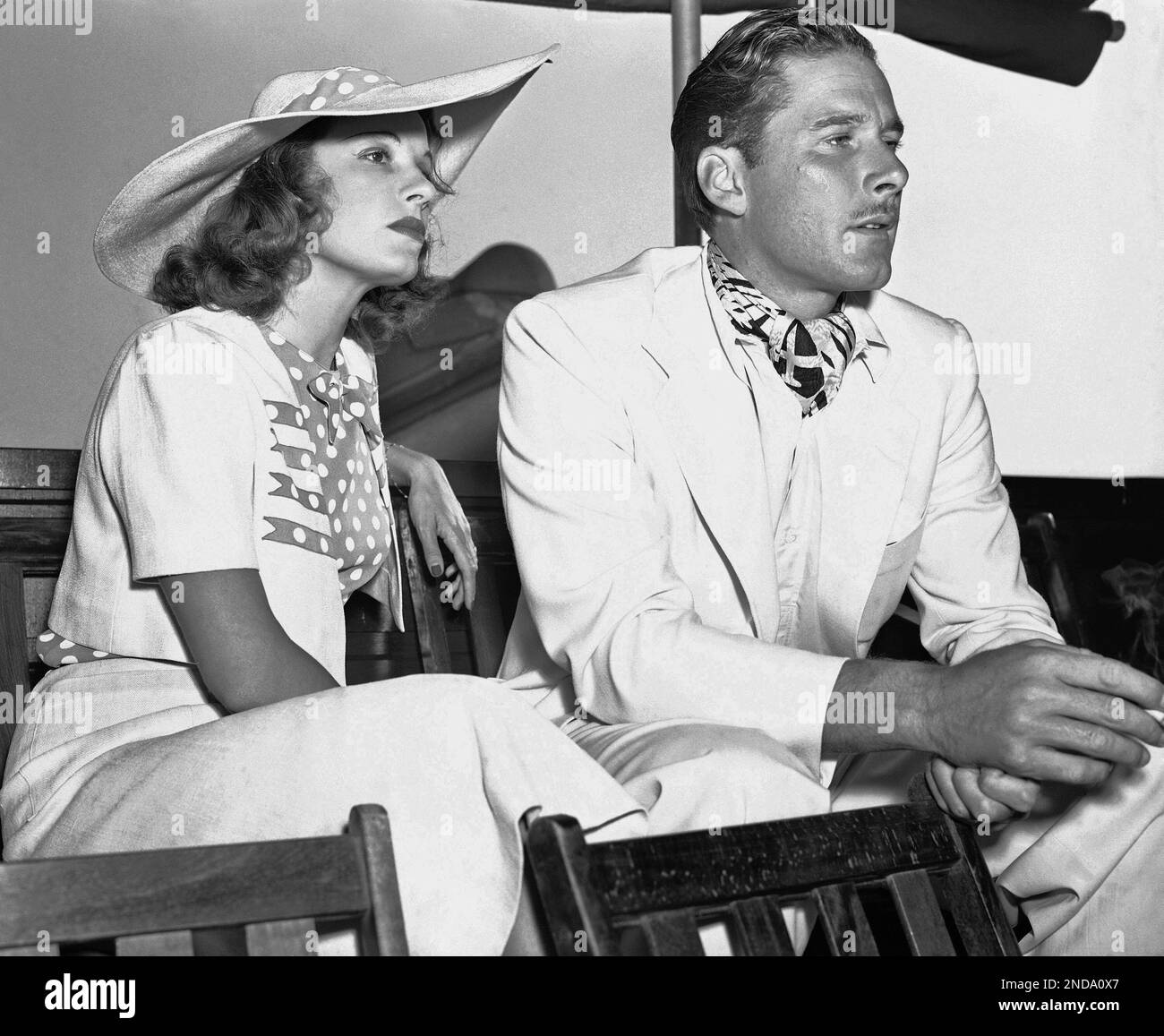 Errol Flynn, swashbucklering hero of the films, is seen as he attends