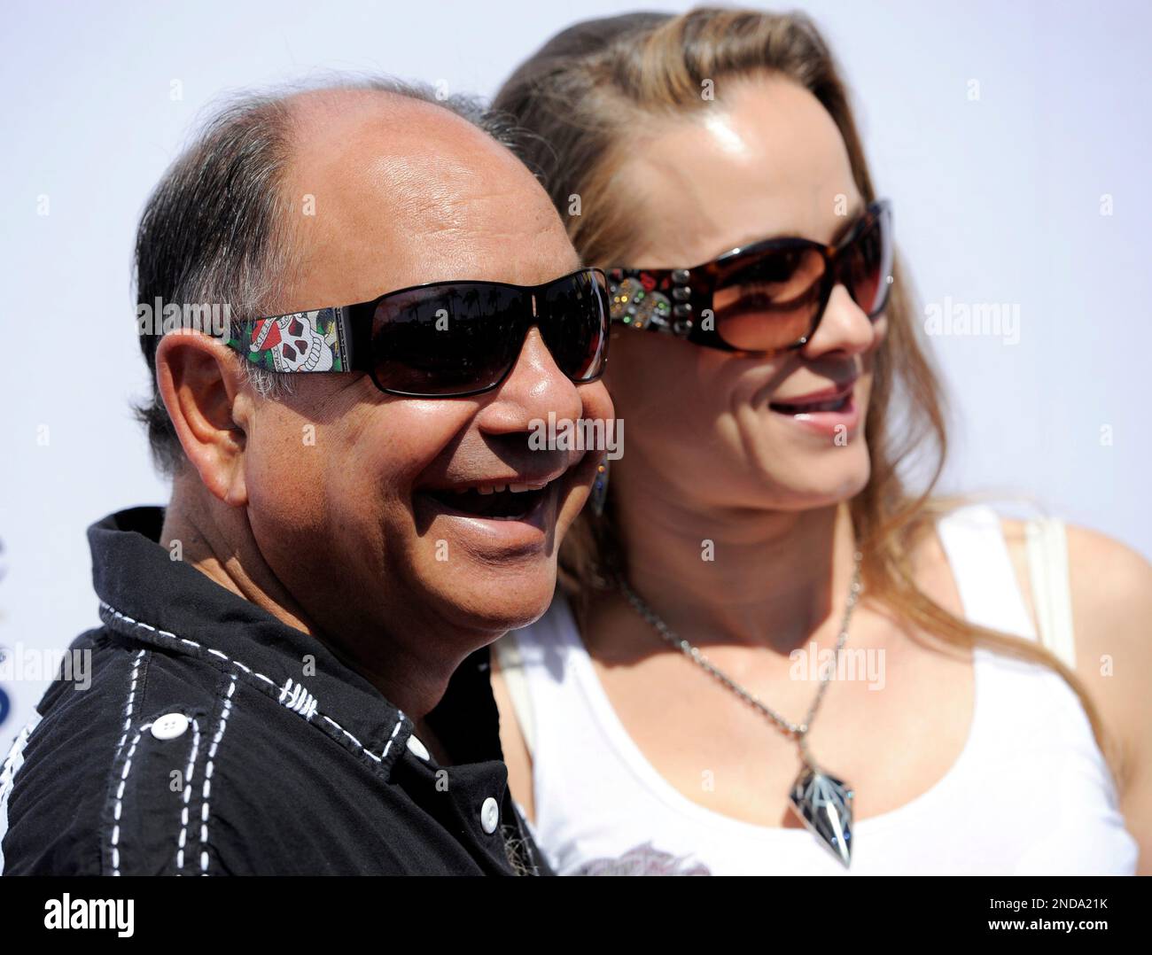 Cheech Marin and his wife Natasha Rubin pose together at the launch of