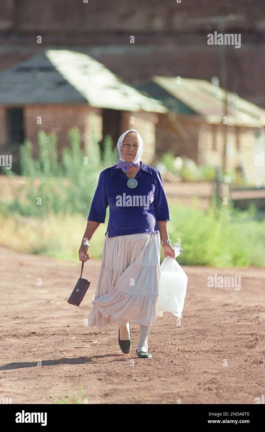 Etta Begay leaves the Basha Supermarket in Tuba City, Arizona, Aug. 30