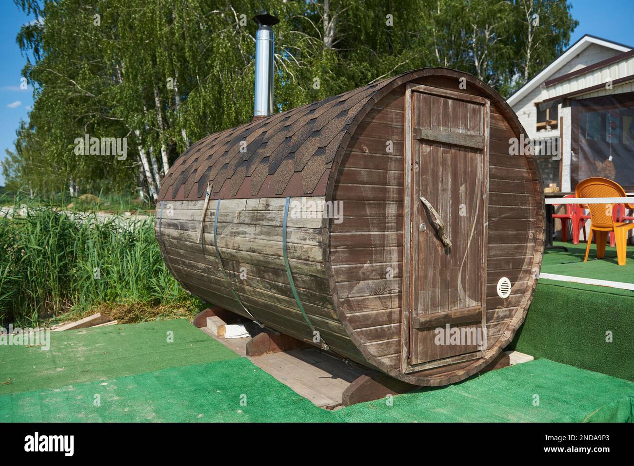 Outdoor small round wooden bathhouse Stock Photo Alamy