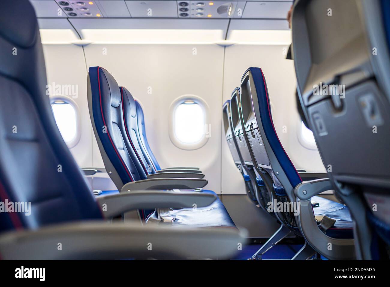 Wizz Air empty blue pink seats with safety instruction. Airplane