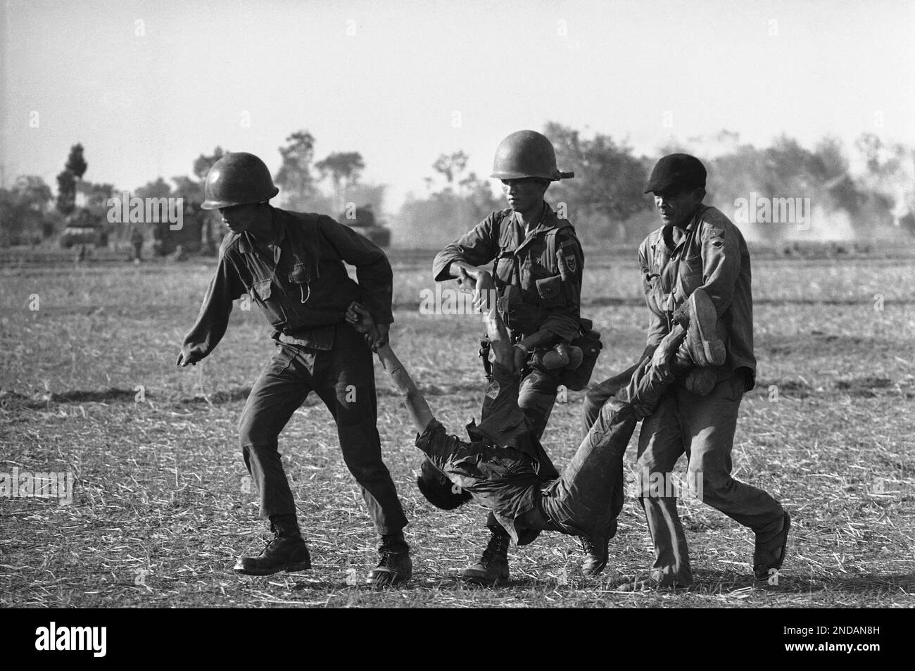 Vietnamese rangers run to the rear during battle with entrenched NVA