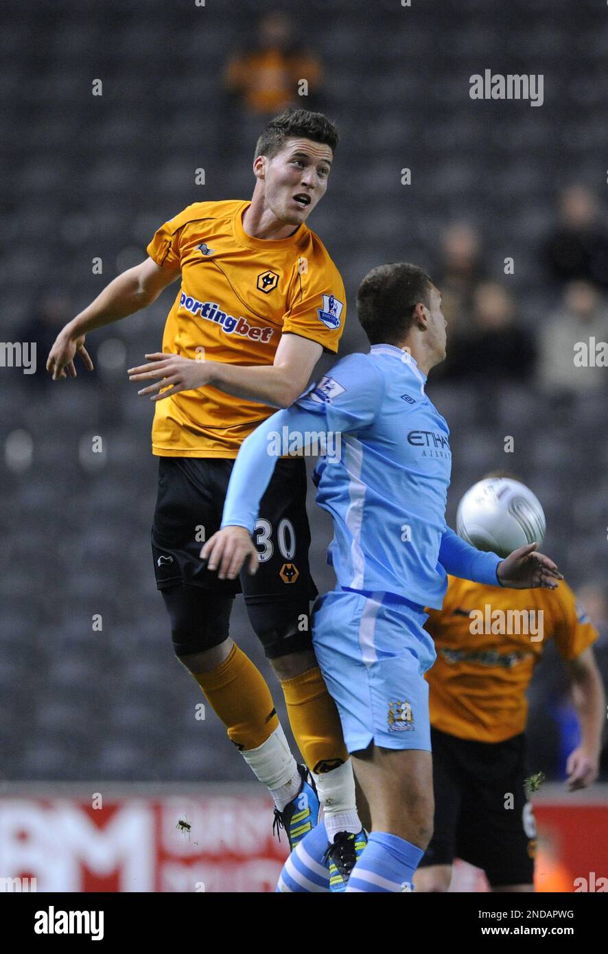Matt Doherty of Wolverhampton Wanderers and Edin Dzeko of Manchester ...
