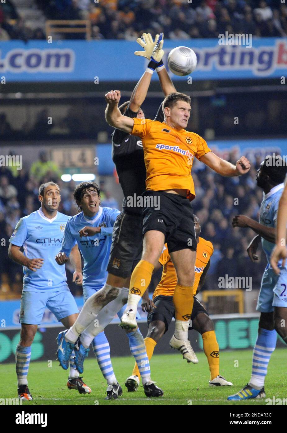 Costel Pantilimon of Manchester City takes the ball off the head of Sam Vokes of Wolverhampton Wanderers Carling Cup 4th round - Wolverhampton Wanderers v Manchester City Stock Photo