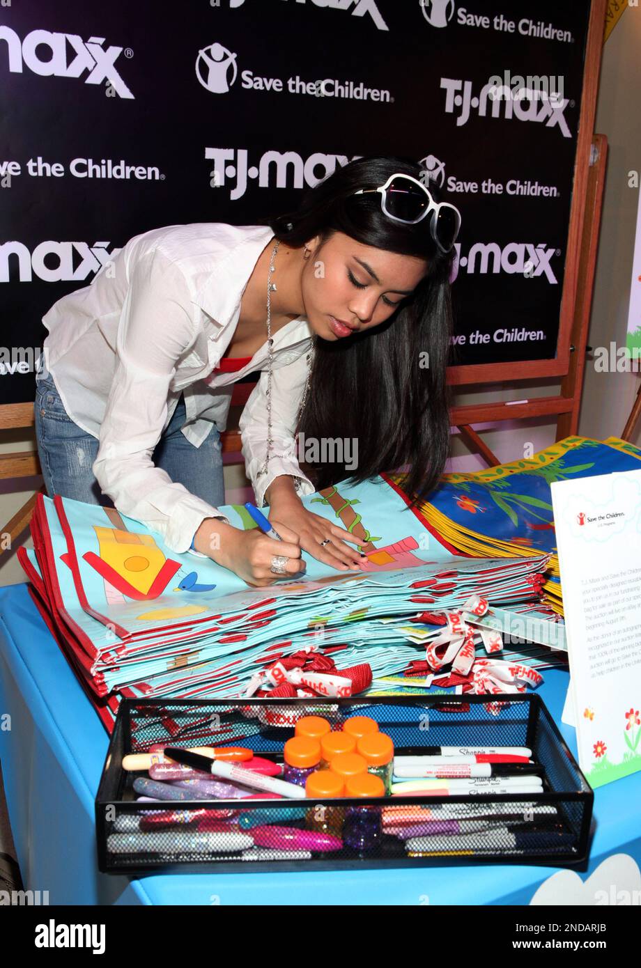 Ashley Argota decorates a tote bag at the T.J.Maxx Teen Choice Lounge on  Thursday, Aug. 5, 2010 in Los Angeles. Celebrity autographed reusable tote  bags will be auctioned off beginning Aug. 9
