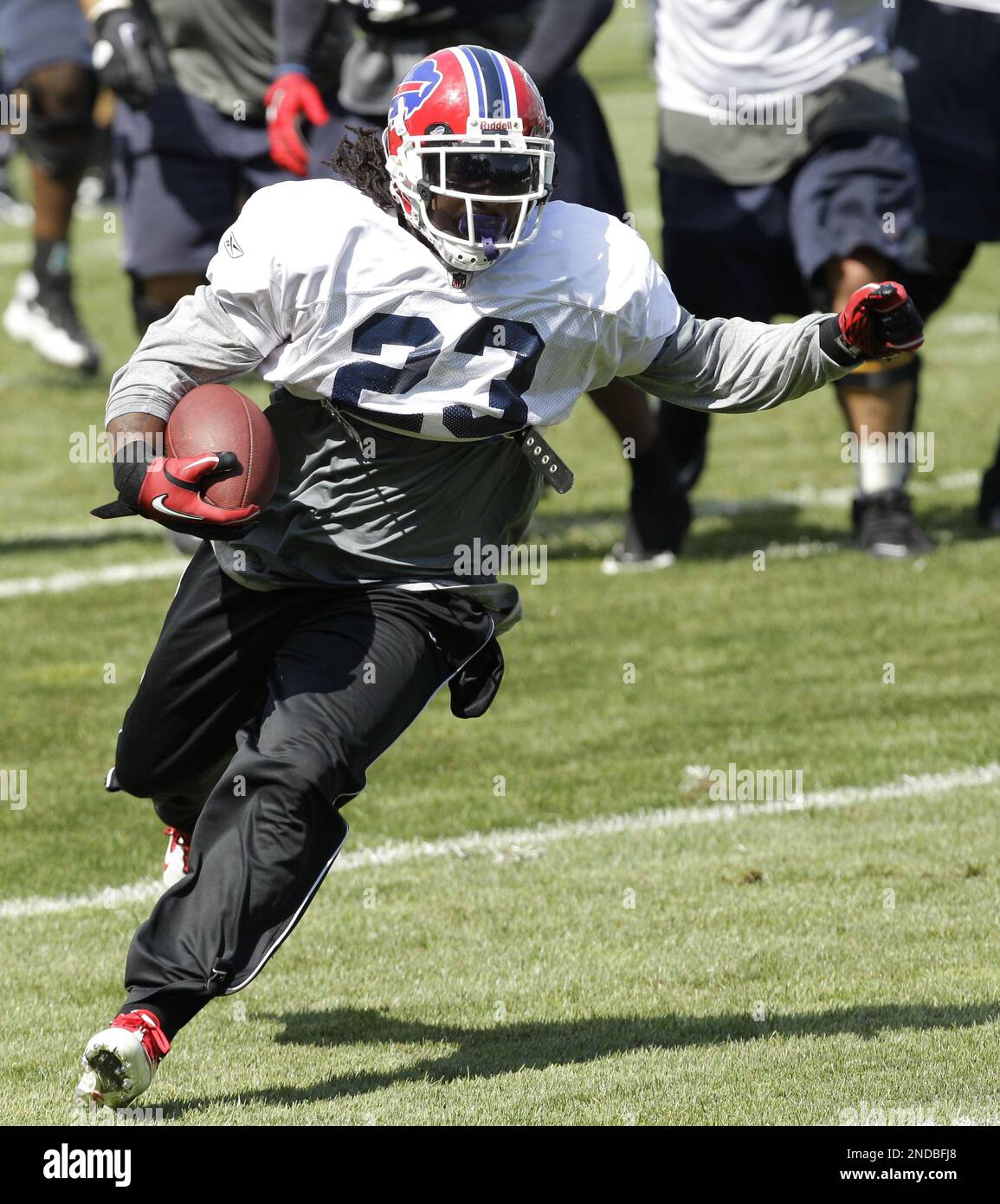 Buffalo Bills' Marshawn Lynch (23) is tackled by Houston Texans' DeMeco  Ryans (59) during the first