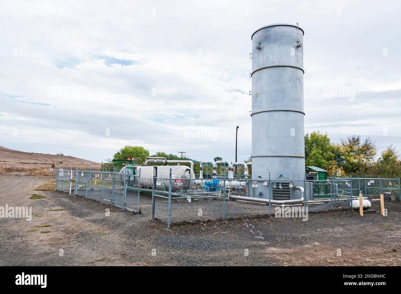 A fenced area containing tanks for methane gas which is generated by and in an active landfill