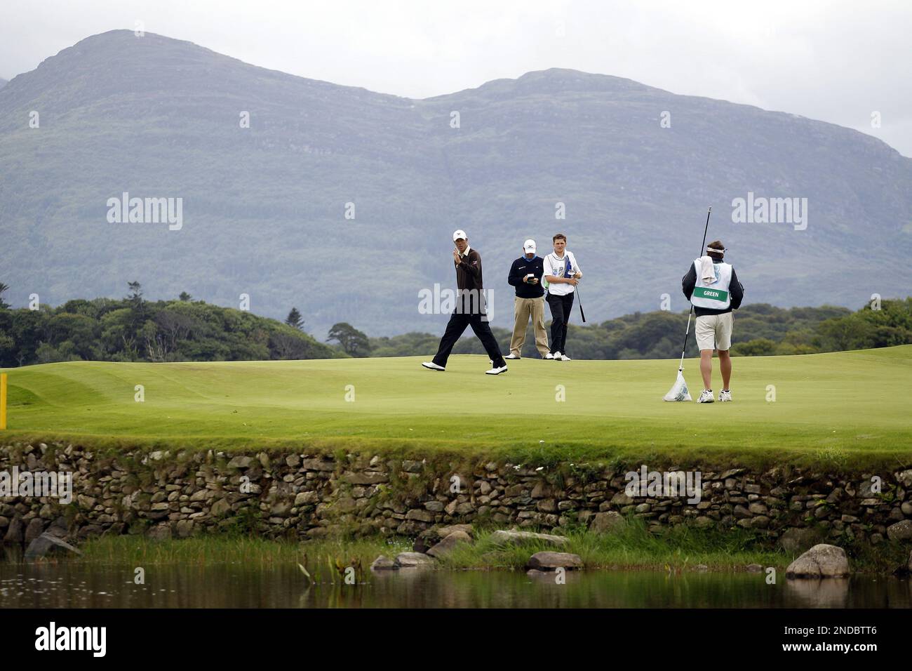 Australia's Richard Green, centre, waves to the crowd after getting a
