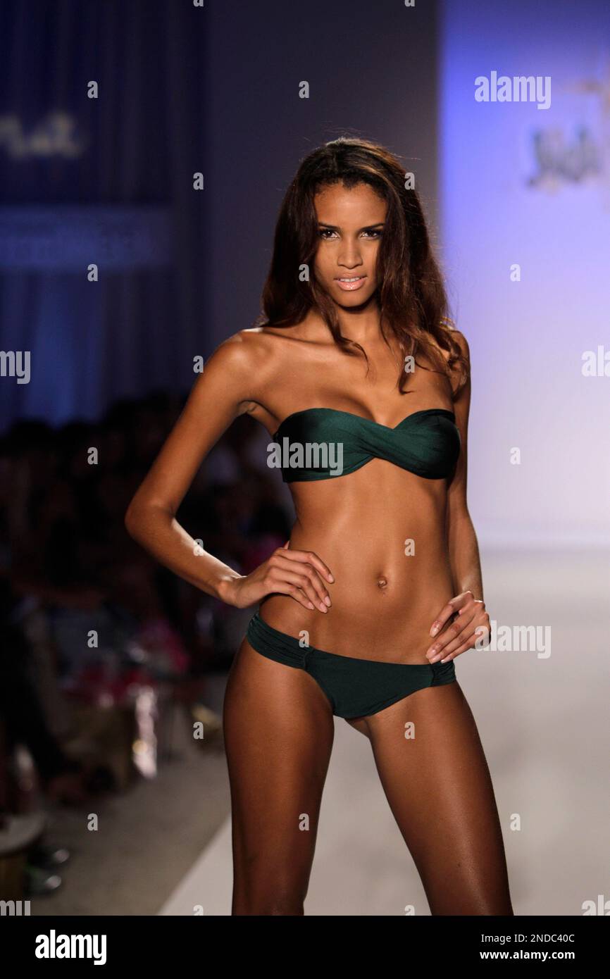 A model walks down the runway during the Luli Fama show at the